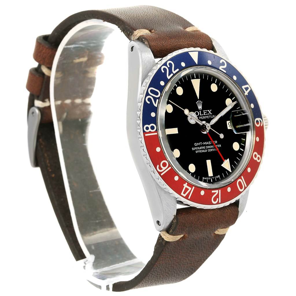 The Vintage Collection model by Rolex is shown from a side angle, highlighting its face, bezel, and brown leather strap.