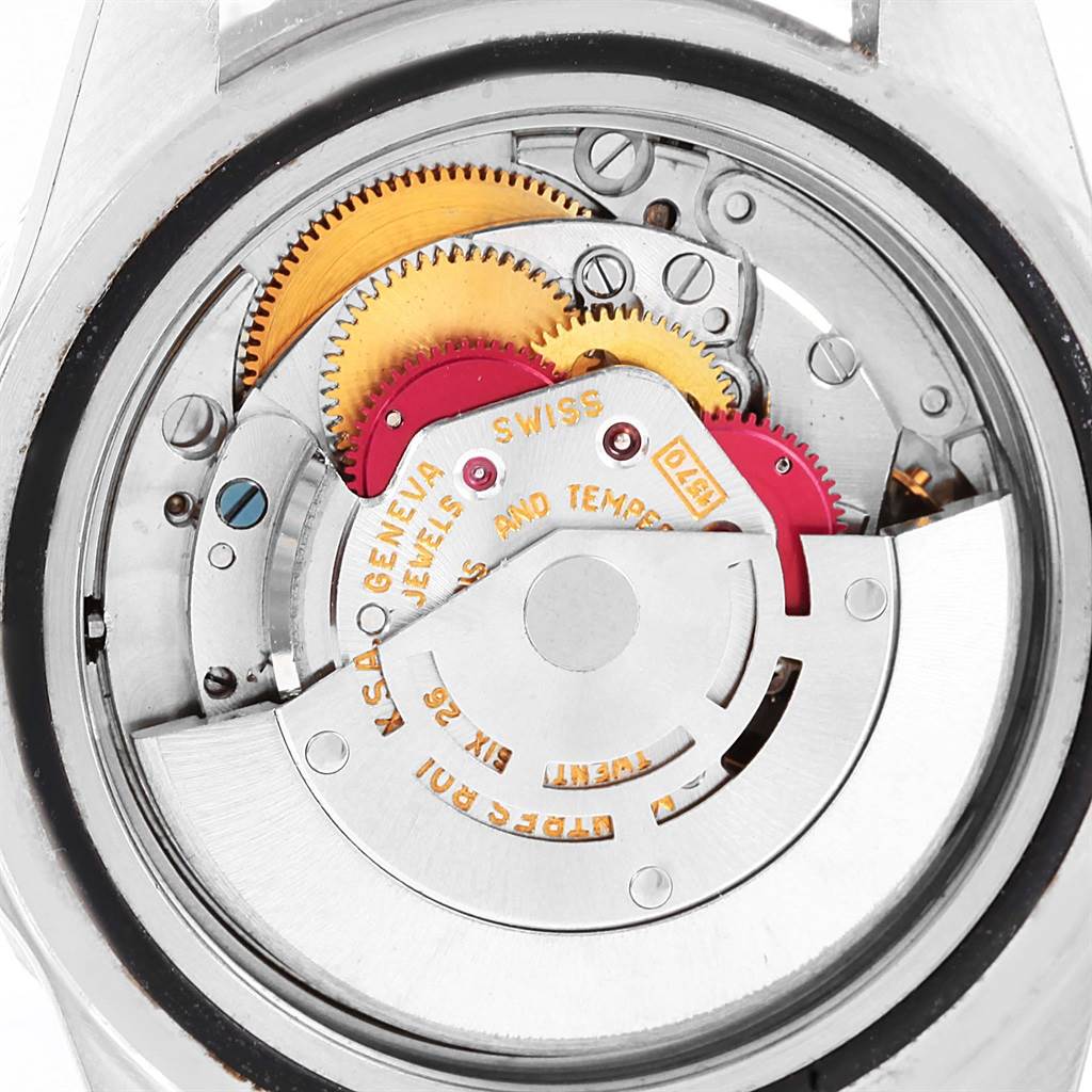 The image shows a close-up of the internal mechanism of the Rolex Vintage Collection 1675 Men's Stainless Steel Black Dial 1675 Men's Stainless Steel Black Dial model watch.