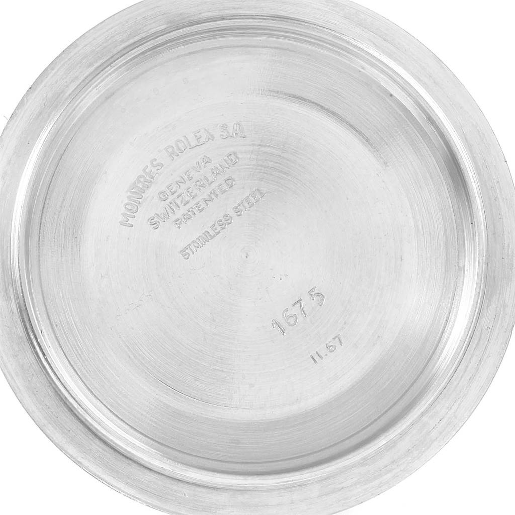 This image shows the inner back case of the Vintage Collection Rolex watch, highlighting engravings such as "Geneva Switzerland," "Stainless Steel," and the model number "1675."