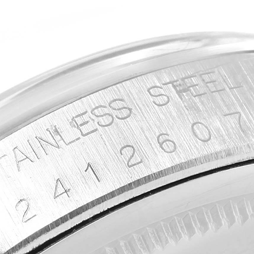 This close-up image shows the engraved serial number on the stainless steel case of a Rolex Vintage Collection 6694 Men's Stainless Steel Silver Dial 6694 Men's Stainless Steel Silver Dial watch.