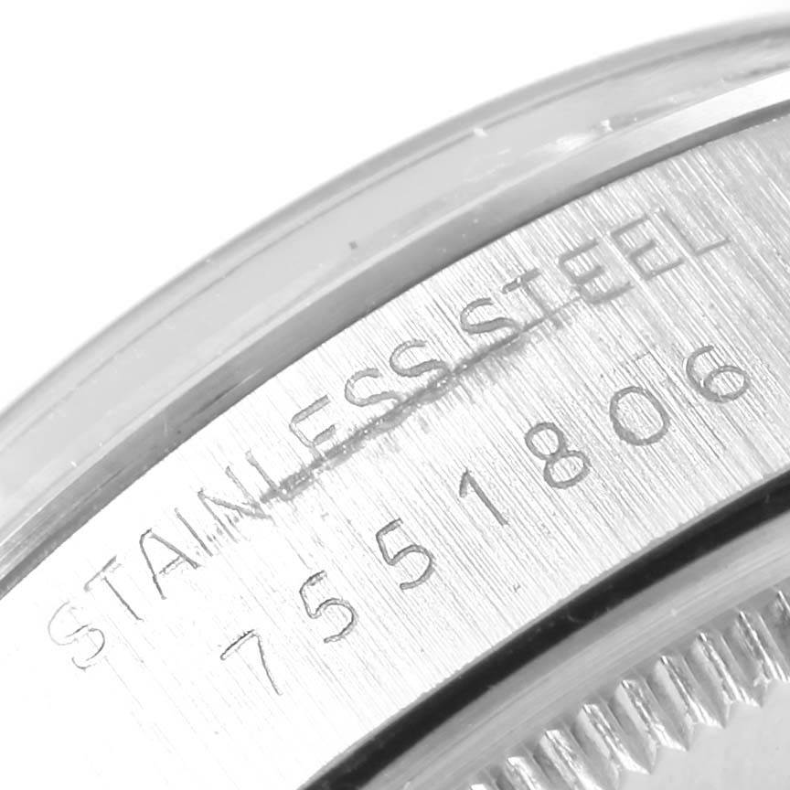 The image shows a close-up of the stainless steel casing and serial number of a Rolex Vintage Collection 5500 Men's Stainless Steel Black Dial 5500 Men's Stainless Steel Black Dial watch.