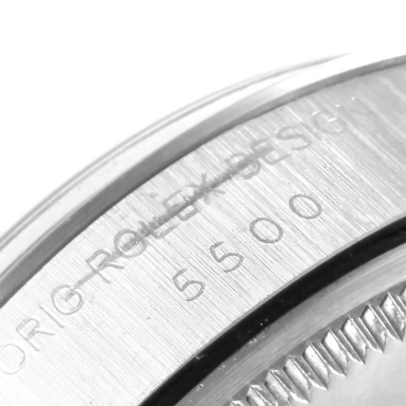 This close-up image shows the serial number engraving on the side of the bezel of a Rolex Vintage Collection 5500 Men's Stainless Steel Black Dial 5500 Men's Stainless Steel Black Dial model.