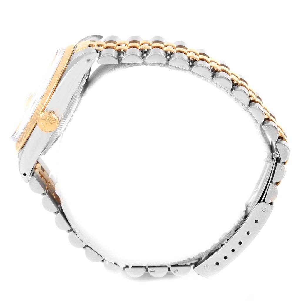 The image shows a side view of the Rolex Vintage Collection 5701 Men's Steel and Gold (two tone) Champagne Dial 5701 Men's Steel and Gold (two tone) Champagne Dial watch, highlighting its crown, bezel, and two-tone bracelet.