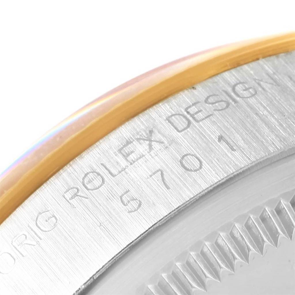 This close-up image shows the engraving on the outer edge of the Rolex Vintage Collection 5701 Men's Steel and Gold (two tone) Champagne Dial 5701 Men's Steel and Gold (two tone) Champagne Dial watch case.