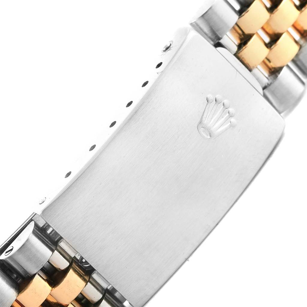 This image shows a close-up of the clasp and part of the bracelet of a Vintage Collection Rolex watch.