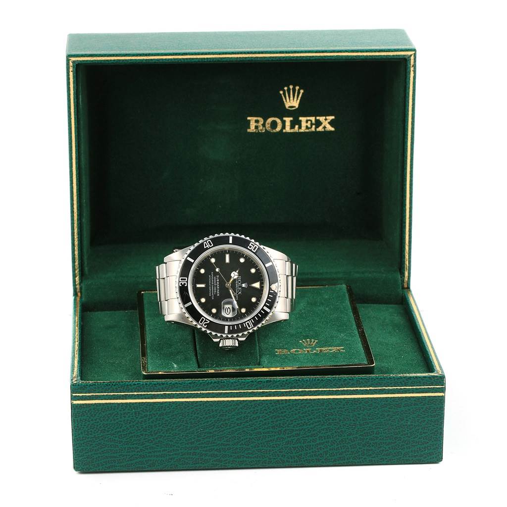 The Rolex Vintage Collection 16800 Men's Stainless Steel Black Dial 16800 Men's Stainless Steel Black Dial watch is shown from the front inside an open green box with branding in gold.