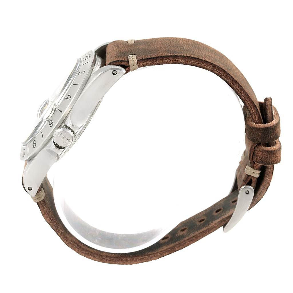 The image shows a Rolex Vintage Collection 1655 Men's Stainless Steel Black Dial 1655 Men's Stainless Steel Black Dial watch from a side angle, focusing on its bezel, crown, and leather strap.