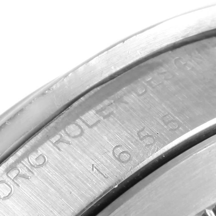 The close-up image shows the engraved text on the side of the casing of a Rolex Vintage Collection 1655 Men's Stainless Steel Black Dial 1655 Men's Stainless Steel Black Dial model watch.