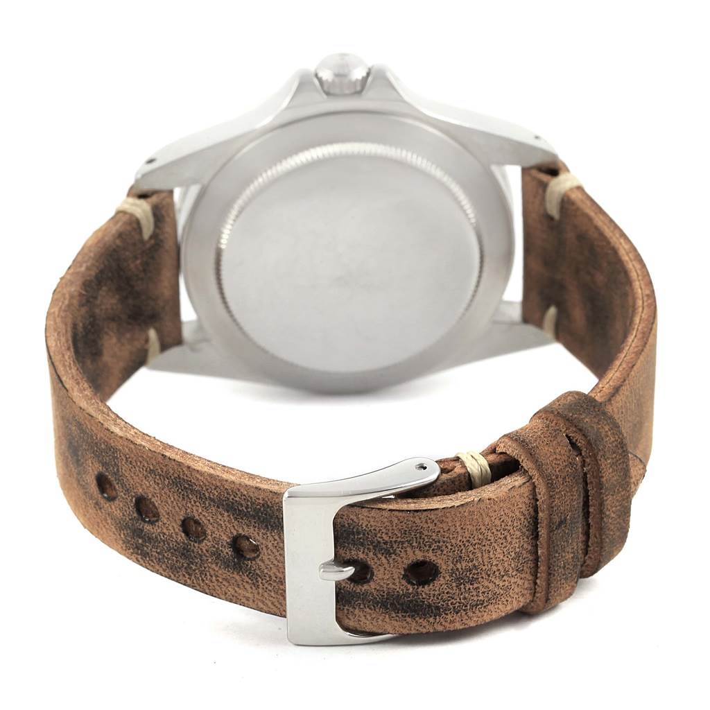 The image shows the back of the case and the leather strap of the Vintage Collection model by Rolex.