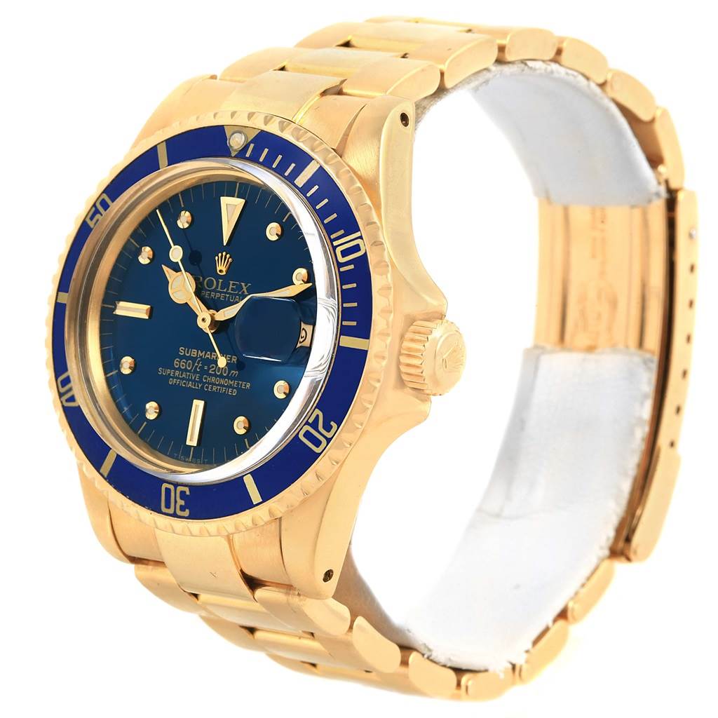 The Rolex Vintage Collection 1680 Men's Yellow Gold Blue Dial 1680 Men's Yellow Gold Blue Dial Submariner model is shown at a slight angle highlighting its gold case, blue dial, bezel, and bracelet.