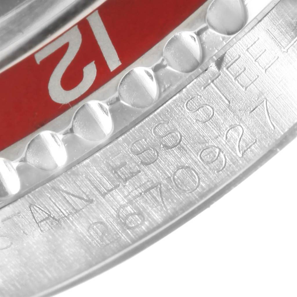 The image shows a close-up of the bezel and part of the engraved case back of the Rolex Vintage Collection 1675 Men's Stainless Steel Black Dial 1675 Men's Stainless Steel Black Dial watch.