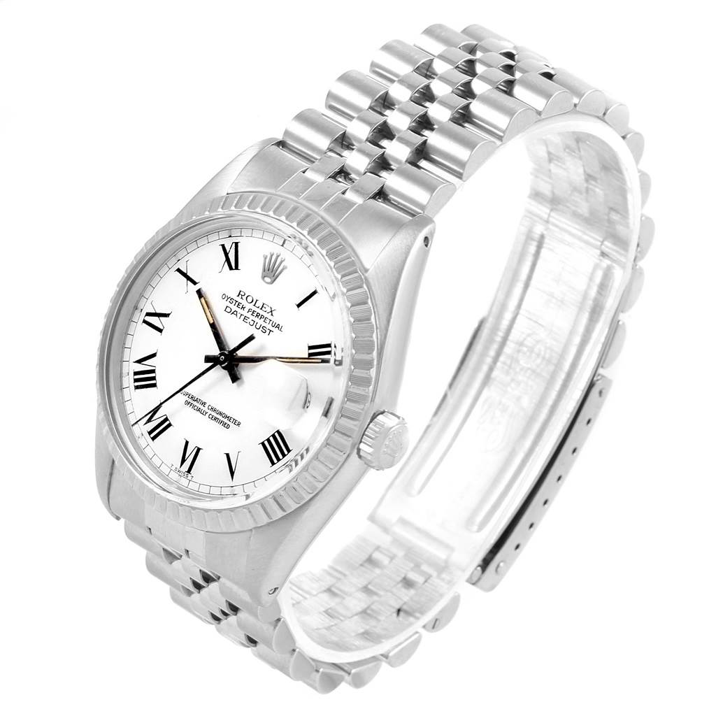 The Vintage Collection Rolex watch is shown from a front angle, displaying its face, bezel, and partially open bracelet.