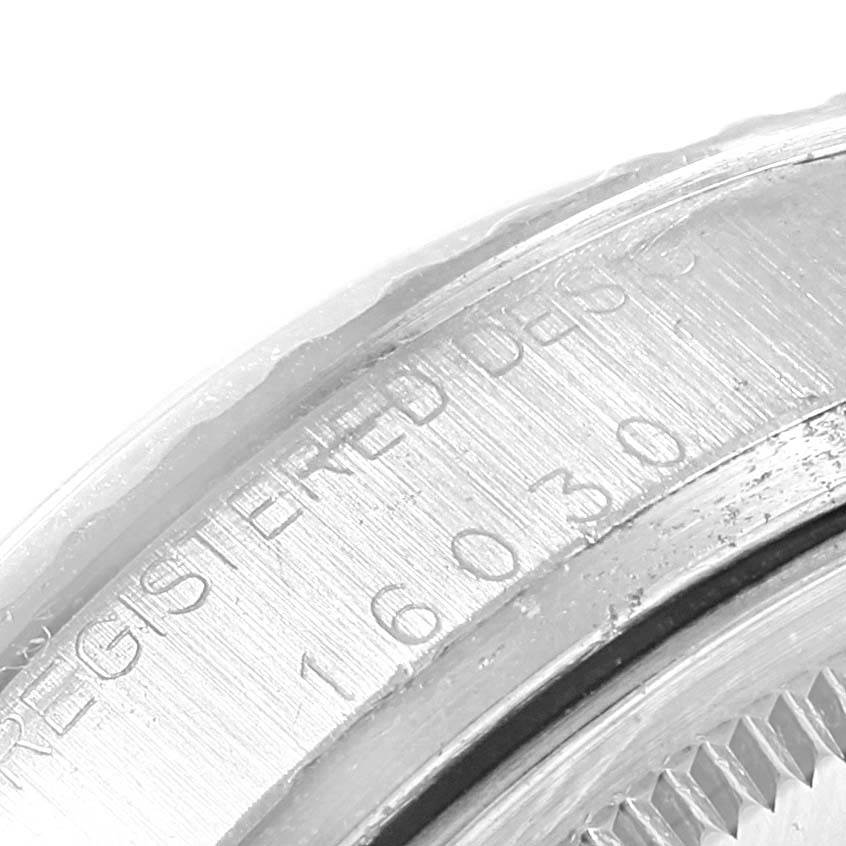 This image shows a close-up of the engraved serial numbers on the bezel of the Rolex Vintage Collection 16030 Men
s Stainless Steel White Dial 16030 Men
s Stainless Steel White Dial watch model.
