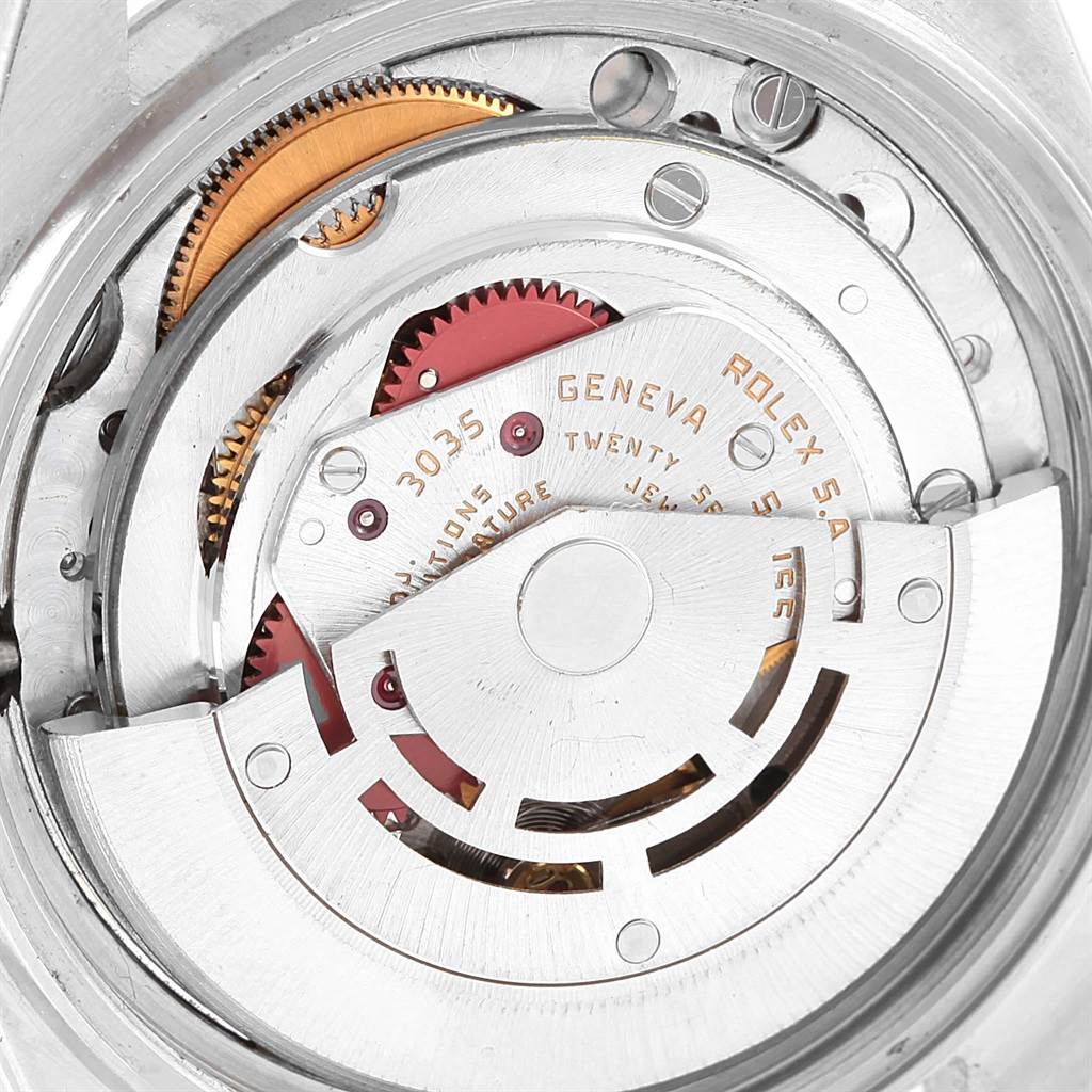 The image shows the intricate internal mechanism of a Rolex Vintage Collection 16030 Men
s Stainless Steel White Dial 16030 Men
s Stainless Steel White Dial model, highlighting gears and inscriptions.