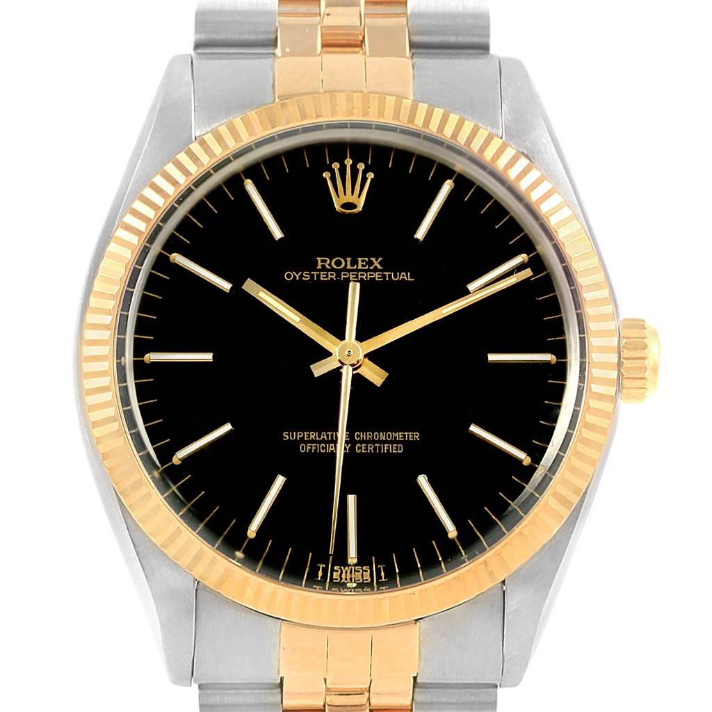 The image shows a front view of the Rolex Vintage Collection 1005 Men's Steel and Gold (two tone) Black Dial 1005 Men's Steel and Gold (two tone) Black Dial watch, highlighting its face, bezel, and part of the bracelet.