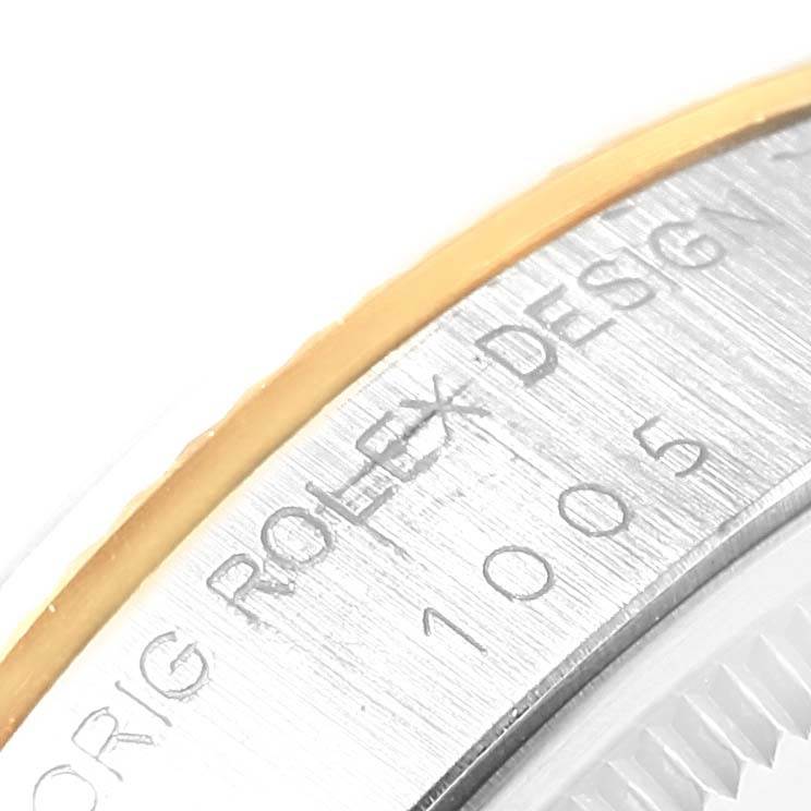 The image shows a close-up of the side of a Rolex Vintage Collection 1005 Men's Steel and Gold (two tone) Black Dial 1005 Men's Steel and Gold (two tone) Black Dial model watch, focusing on the engraved markings.