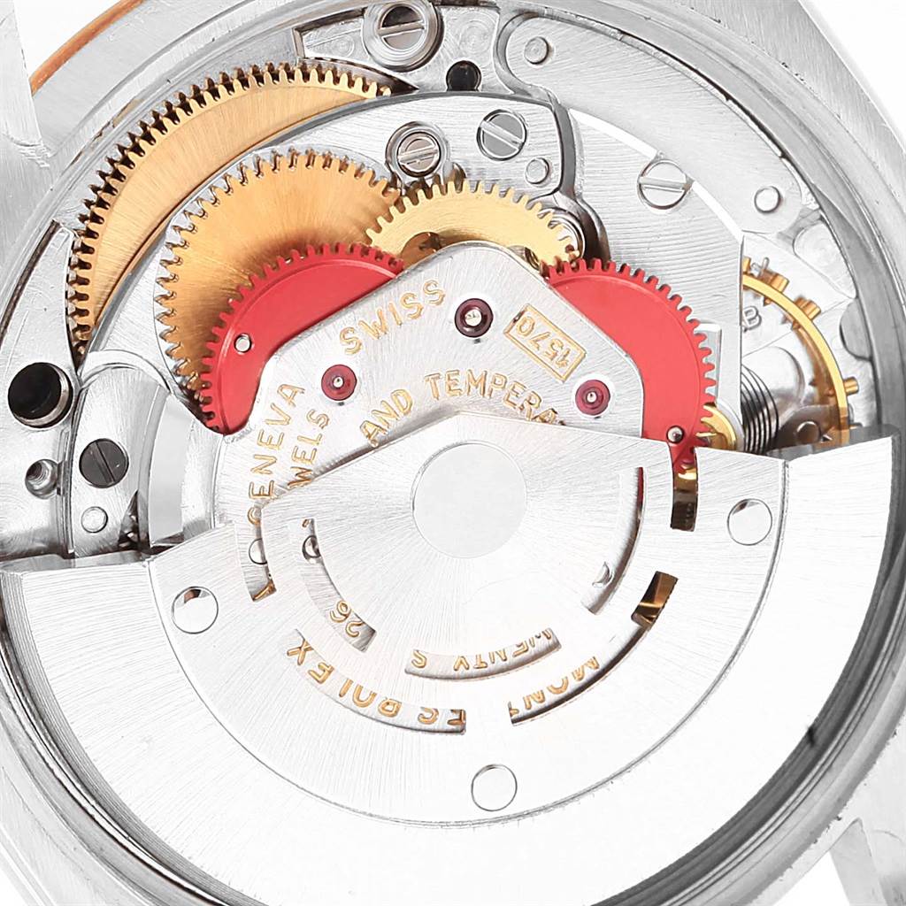 This is a close-up view of the mechanical movement of the Vintage Collection model by Rolex, showing gears and intricate components.