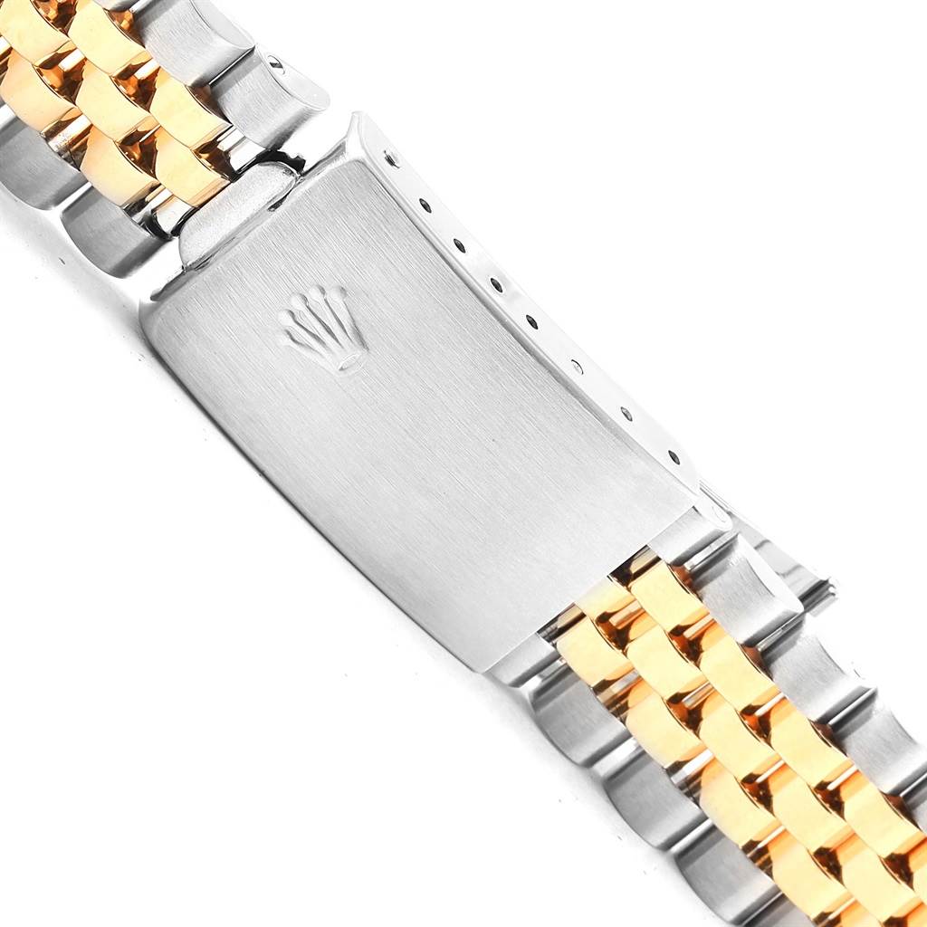 The image shows a close-up of the clasp and bracelet of the Rolex Vintage Collection 1005 Men's Steel and Gold (two tone) Black Dial 1005 Men's Steel and Gold (two tone) Black Dial watch, featuring stainless steel and gold links.