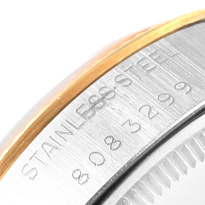 The image shows a close-up view of the bezel edge and engraved stainless steel component of a Vintage Collection model by Rolex.