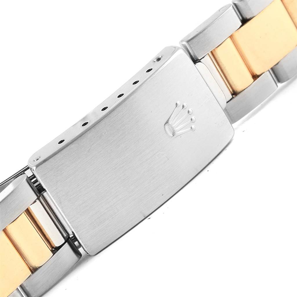 The image shows a close-up of the clasp and part of the bracelet of a Rolex Vintage Collection 1005 Men's Steel and Gold (two tone) White Dial 1005 Men's Steel and Gold (two tone) White Dial watch.