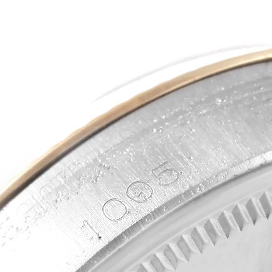 This close-up image shows a partial view of the case back and edge detailing of the Rolex Vintage Collection 1005 Men's Steel and Gold (two tone) White Dial 1005 Men's Steel and Gold (two tone) White Dial model.
