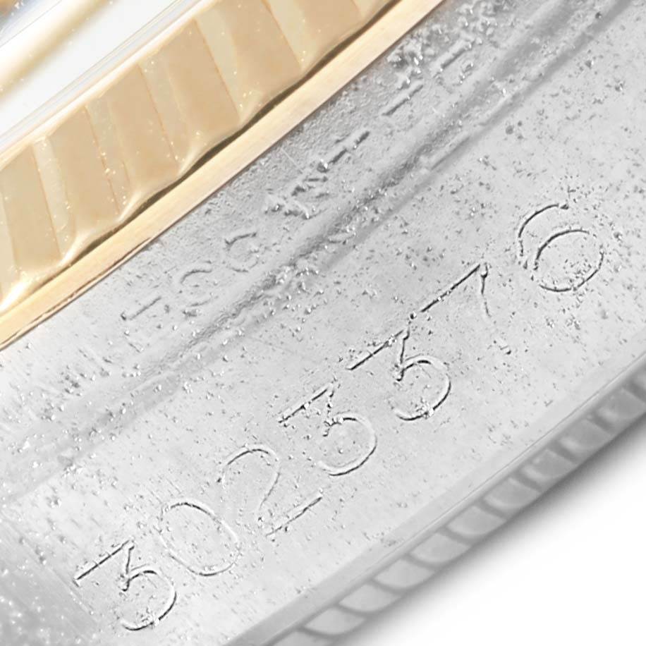This image shows a close-up of the serial number engraved on the case side of a Rolex Vintage Collection 1005 Men's Steel and Gold (two tone) White Dial 1005 Men's Steel and Gold (two tone) White Dial model.
