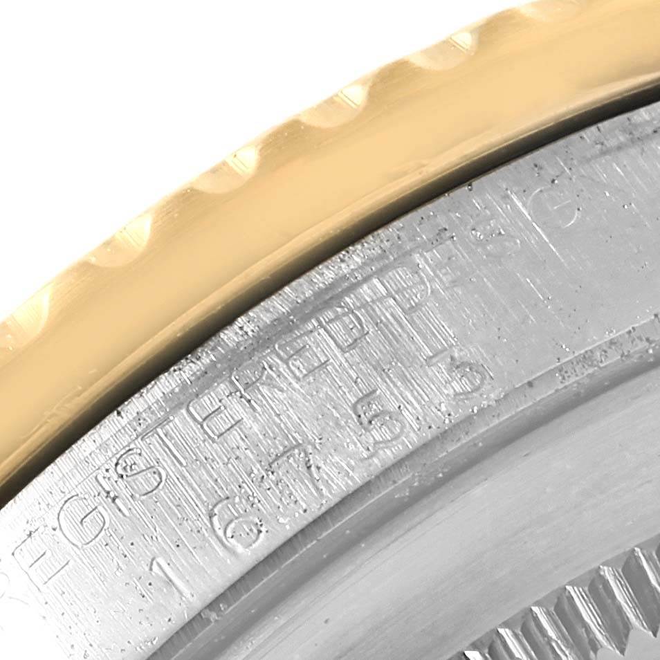 The image shows a close-up of the bezel and case back edge of a Vintage Collection model by Rolex.