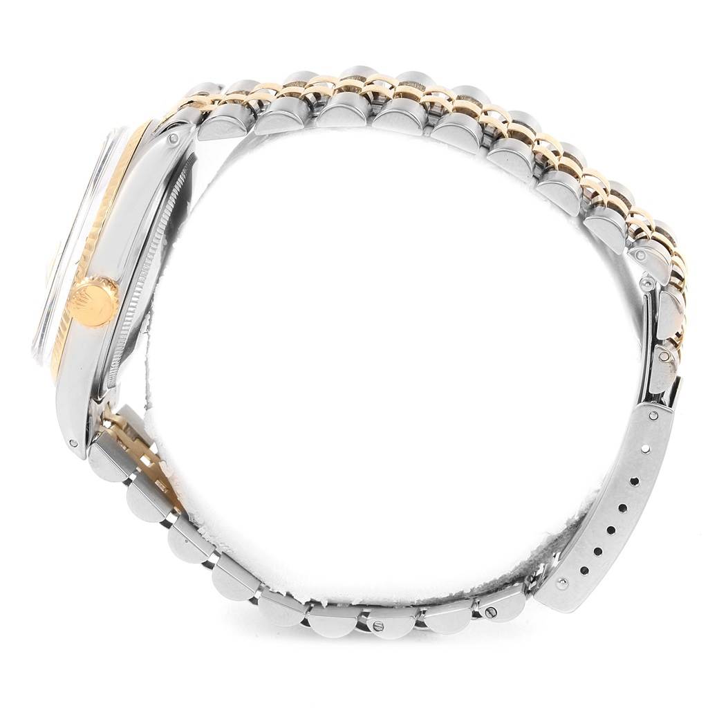 The Rolex Vintage Collection 1600 Men's Stainless Steel Black Dial 1600 Men's Stainless Steel Black Dial watch is shown from the side angle, featuring its case, crown, and two-tone bracelet.