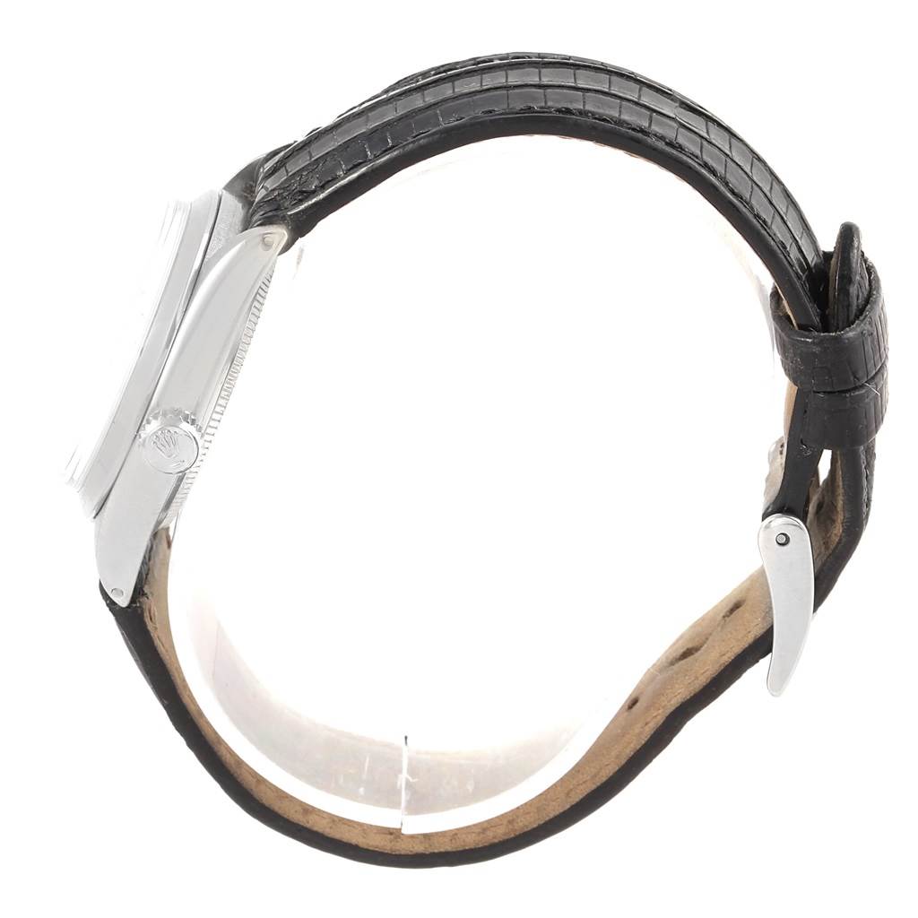 The image shows a side view of the Rolex Vintage Collection 6466 Men's Stainless Steel Silver Dial 6466 Men's Stainless Steel Silver Dial watch, highlighting its black leather strap and case side.