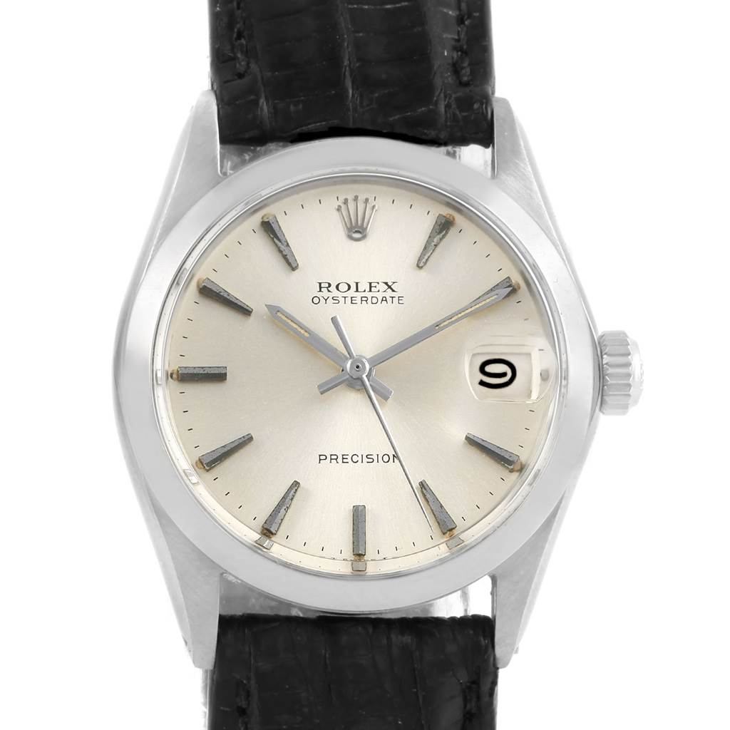 The image shows a front view of the Rolex Vintage Collection 6466 Men's Stainless Steel Silver Dial 6466 Men's Stainless Steel Silver Dial Oysterdate watch, highlighting its dial, hands, date window, and crown.