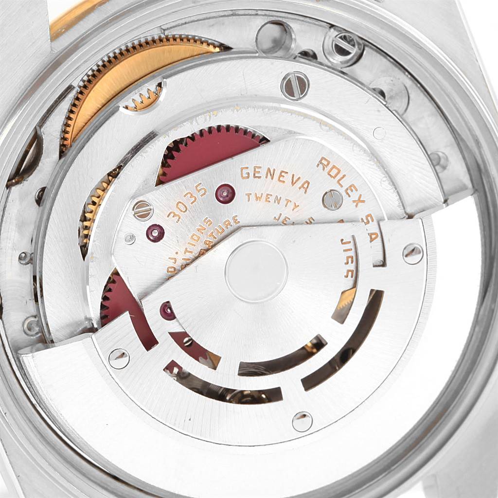 The image shows a close-up view of the internal mechanical movement of a Rolex Vintage Collection 15003 Men's Steel and Gold (two tone) Blue Dial 15003 Men's Steel and Gold (two tone) Blue Dial watch.