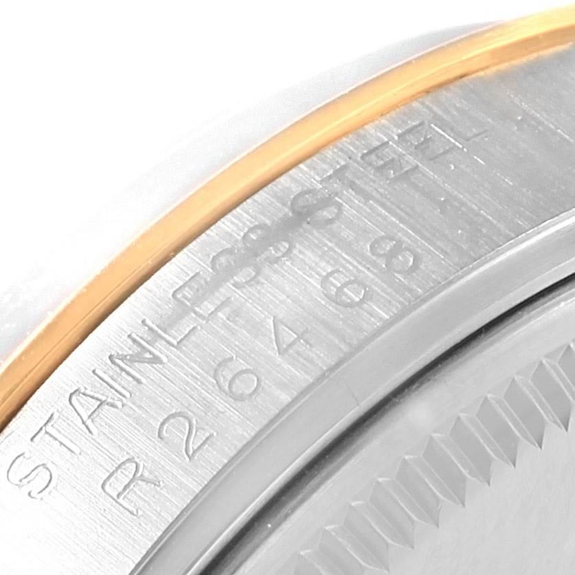 The image shows a close-up of the side engraving and part of the bezel of the Rolex Vintage Collection 15003 Men's Steel and Gold (two tone) Blue Dial 15003 Men's Steel and Gold (two tone) Blue Dial watch.