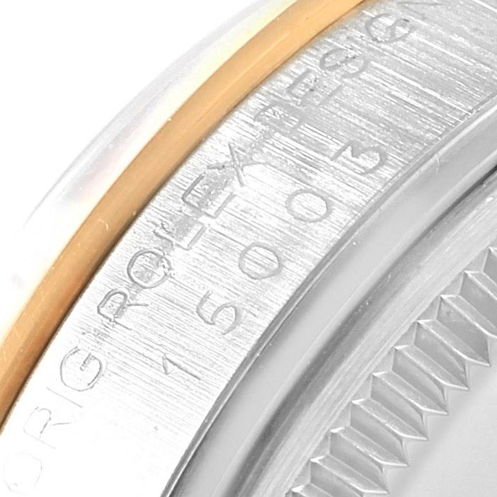 This close-up angle shows the engraved side and bezel of a Rolex Vintage Collection 15003 Men's Steel and Gold (two tone) Blue Dial 15003 Men's Steel and Gold (two tone) Blue Dial watch.