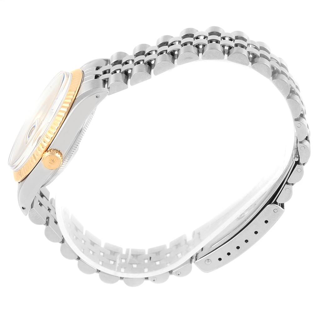 This image shows a side view of the Rolex Vintage Collection 5701 Men's Steel and Gold (two tone) Champagne Dial 5701 Men's Steel and Gold (two tone) Champagne Dial watch, focusing on the bezel, crown, and bracelet.