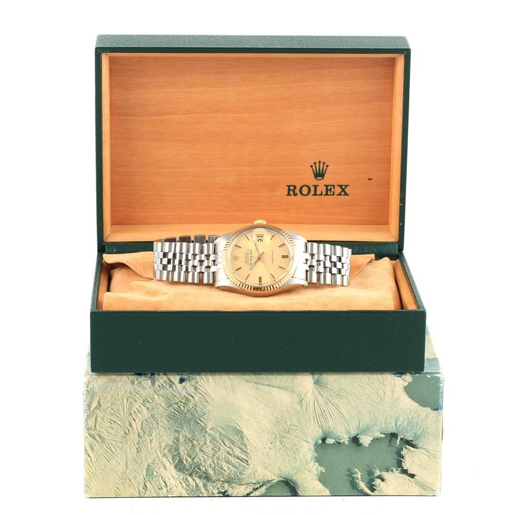 The Rolex Vintage Collection 5701 Men's Steel and Gold (two tone) Champagne Dial 5701 Men's Steel and Gold (two tone) Champagne Dial watch is shown from the front, with its face, bracelet, and original box visible.