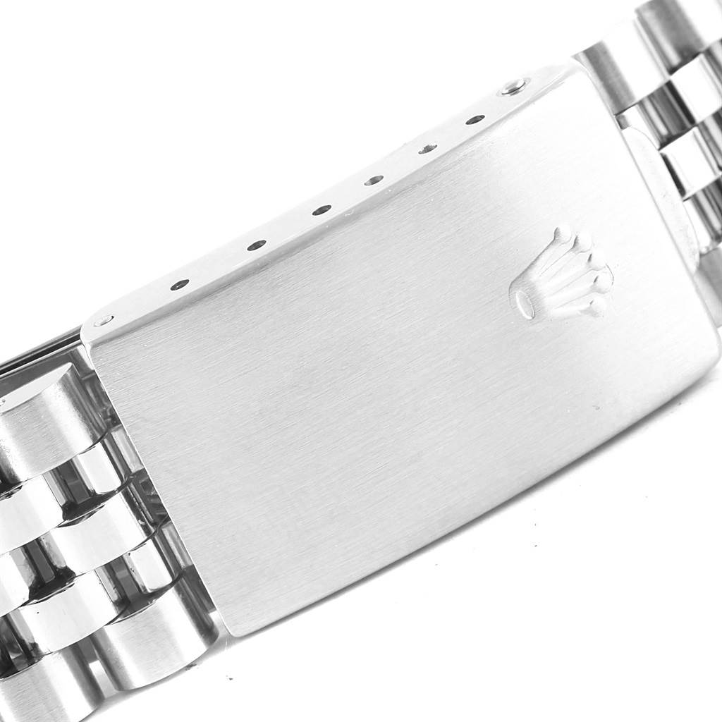 This image shows a close-up of the clasp on a Vintage Collection Rolex watch band, highlighting the Rolex logo.