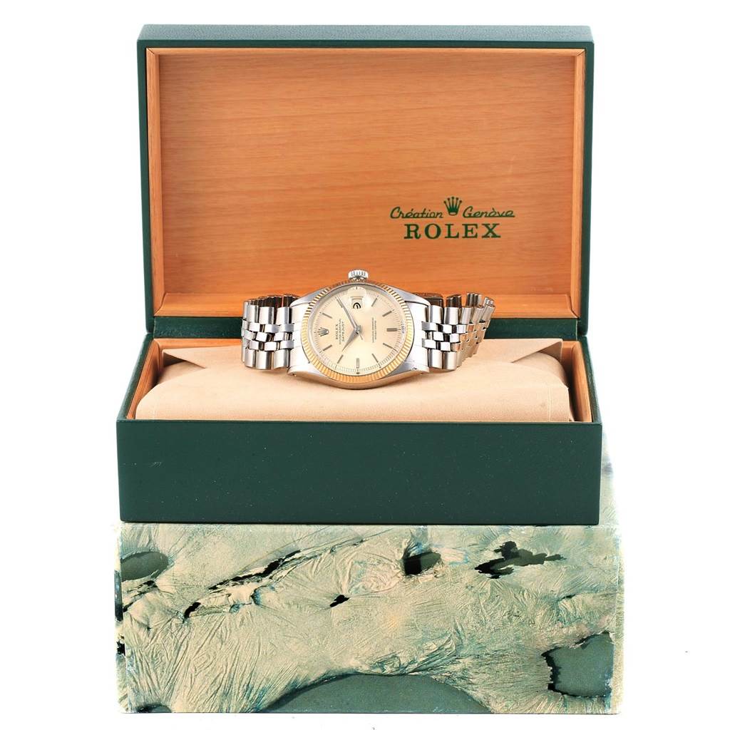 The Rolex Vintage Collection 6605 Men's Stainless Steel Silver Dial 6605 Men's Stainless Steel Silver Dial model is shown from the front, with its bracelet partially spread out, placed in an open, branded box.