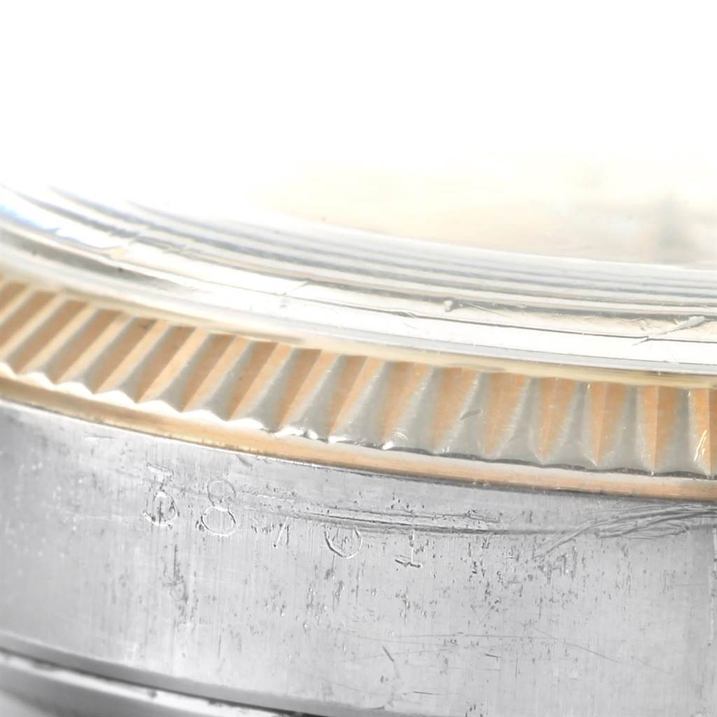 This image shows a close-up of the edge of the bezel and part of the case of the Vintage Collection model by Rolex.
