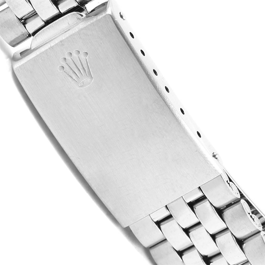 This image shows the clasp with the Rolex logo and part of the bracelet of a Rolex Vintage Collection 1501 Stainless Steel Silver Dial 1501 Stainless Steel Silver Dial watch.