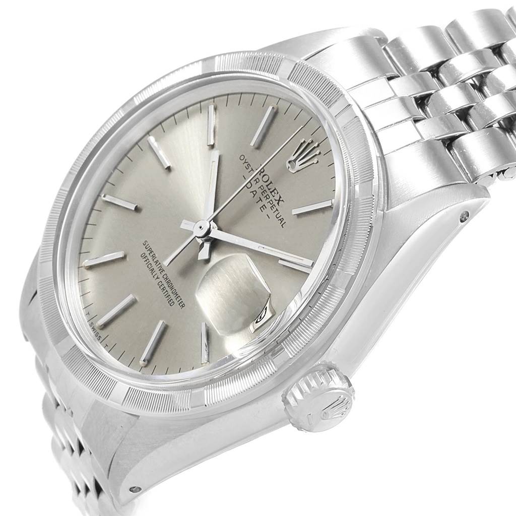 The image shows a close-up view of the dial, case, crown, and part of the bracelet of a Vintage Collection Rolex watch.