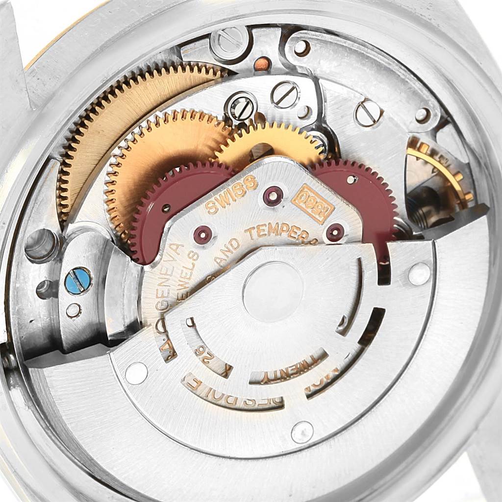 This image shows a close-up view of the intricate inner mechanical movements and gears of the Rolex Vintage Collection 1601 Men's Steel and Gold (two tone) Silver Dial 1601 Men's Steel and Gold (two tone) Silver Dial watch.