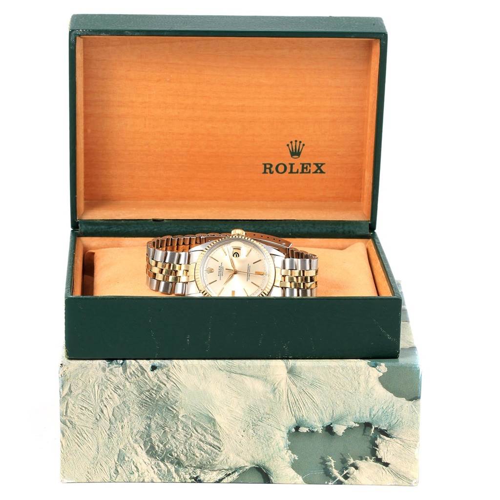 The image shows a Rolex Vintage Collection 1601 Men's Steel and Gold (two tone) Silver Dial 1601 Men's Steel and Gold (two tone) Silver Dial watch at a frontal angle, displayed in an open green and tan box.