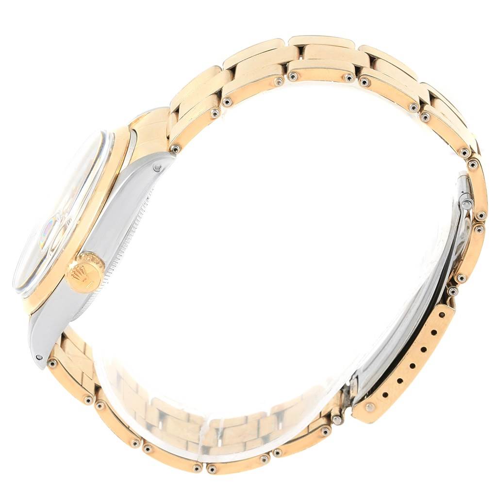 This image of the Rolex Vintage Collection 1500 Men's Stainless Steel Brown Dial 1500 Men's Stainless Steel Brown Dial watch shows a side view of the case and bracelet, showcasing the crown and band links.