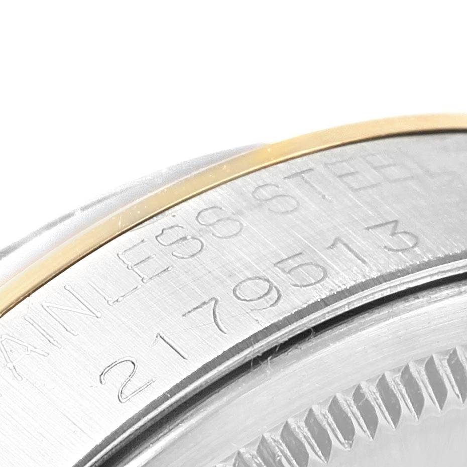 This image shows a close-up angle of the stainless steel case with engraved serial number on a Vintage Collection Rolex watch.
