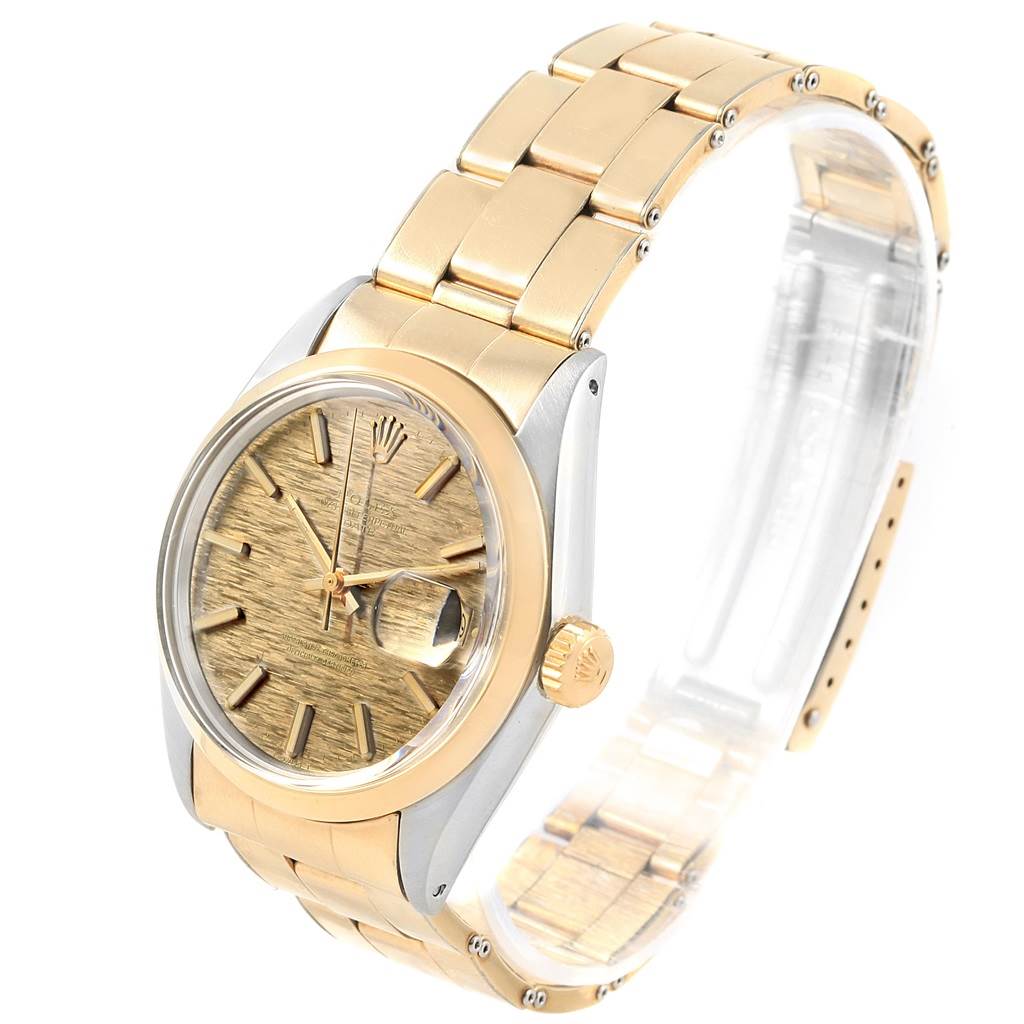 The Rolex Vintage Collection 1500 Men's Stainless Steel Brown Dial 1500 Men's Stainless Steel Brown Dial watch is shown at an angle highlighting its gold dial, crown, and two-tone bracelet.