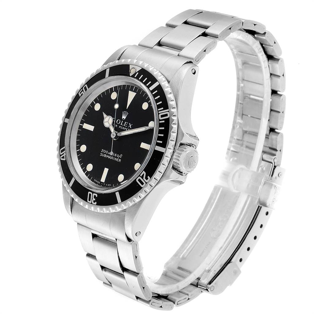 The image shows a Rolex Vintage Collection 5513 Men
s Stainless Steel Black Dial 5513 Men
s Stainless Steel Black Dial watch at a 3/4 angle, displaying its face, bezel, crown, and bracelet.
