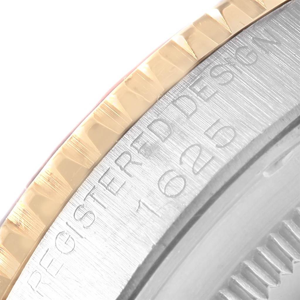 The image shows a close-up view of the bezel and edge of the casing of a Vintage Collection Rolex watch.