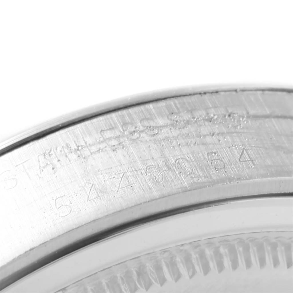 This image shows a close-up of the case back of the Rolex Vintage Collection 6694 Men's Stainless Steel Blue Dial 6694 Men's Stainless Steel Blue Dial watch with model number engravings.