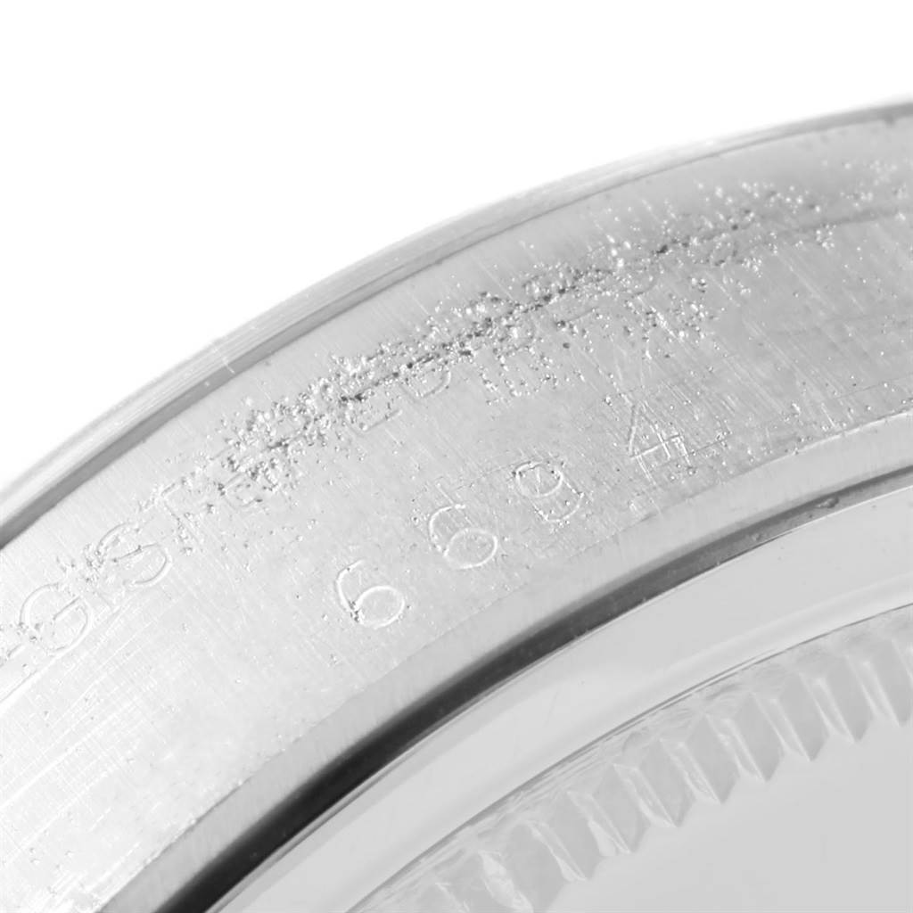 This image shows a close-up of the serial number engraved on the case of the Vintage Collection Rolex watch.