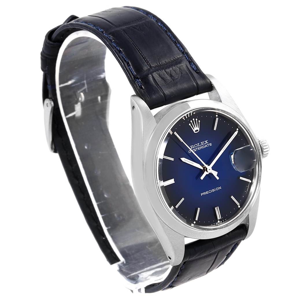 The Rolex Vintage Collection 6694 Men's Stainless Steel Blue Dial 6694 Men's Stainless Steel Blue Dial watch is shown at a three-quarter angle, highlighting the blue dial, silver casing, and leather strap.